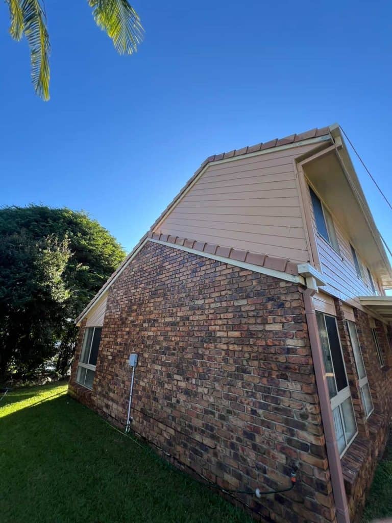 Two-storey brick house with clean cladding after house washing in Brisbane