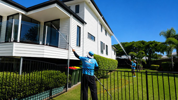 Jetstream technician soft washing a two-storey house in Brisbane